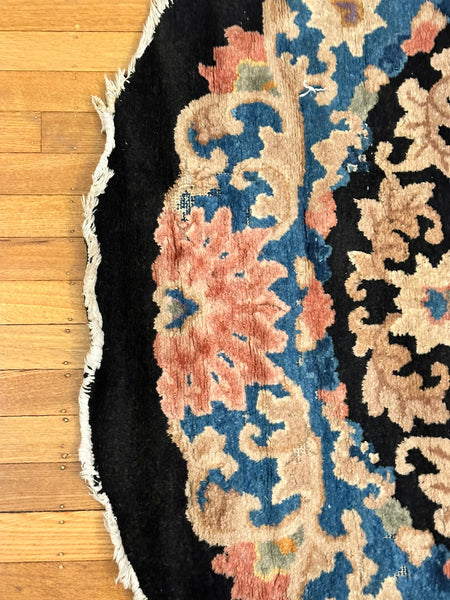 Chinese Oval Rug. Black Ground. Circa 1920s. 7' 9.5" x 4' 1.5". (LTD)