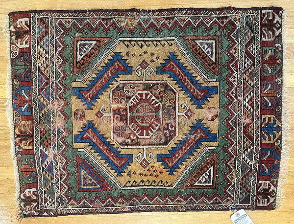 Rug. Caucasian. Tan Ground, Greens, Red, and Blue. Circa 1910. 34" x 26" (CABE)