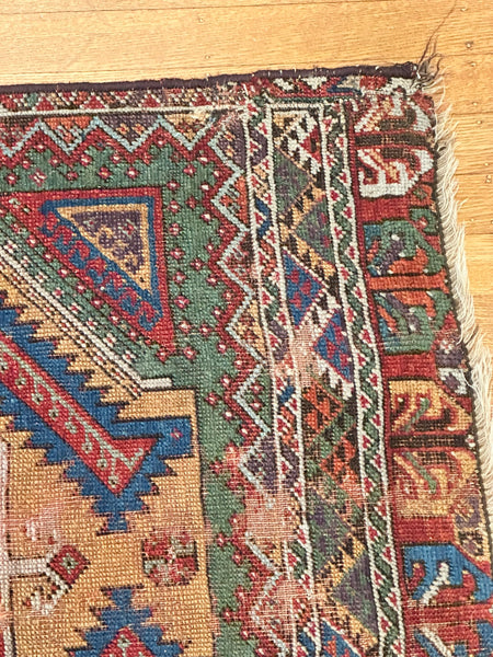 Rug. Caucasian. Tan Ground, Greens, Red, and Blue. Circa 1910. 34" x 26" (CABE)